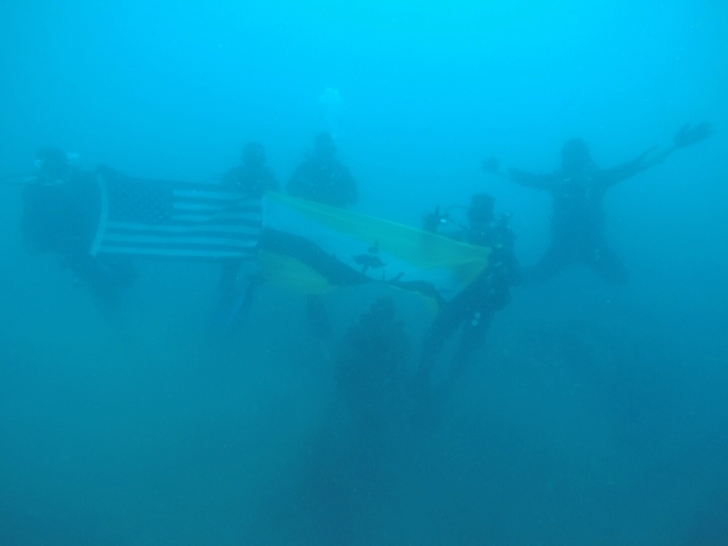 U.S. Navy Divers attached to Mobile Diving & Salvage Company ONE divers serving with the Royal Brunei Armed Forces gather for a group photo at the wreckage site of USS Salute (AM-294), which sank in Brunei waters on June 7, 1945, during Cooperation Afloat Readiness and Training (CARAT) Brunei 2016, Nov. 15. CARAT is a series of annual maritime exercises between the U.S. Navy, U.S. Marine Corps and the armed forces of nine partner nations to include Bangladesh, Brunei, Cambodia, Indonesia, Malaysia, the Philippines, Singapore, Thailand, and Timor-Leste.