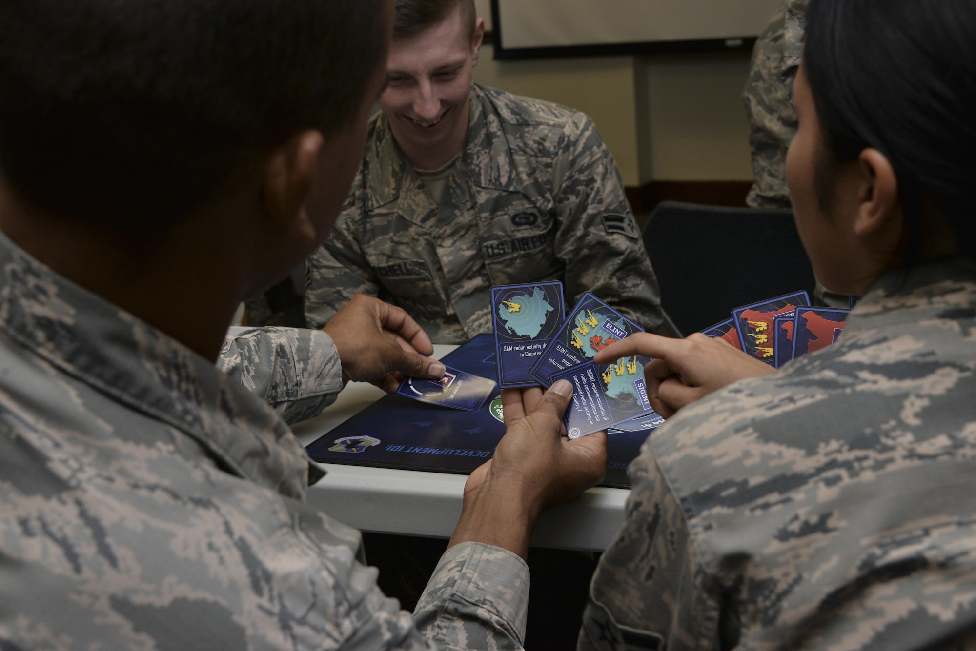Airmen from the 70th Intelligence, Surveillance and Reconnaissance Wing play BLUE TALON, an interactive mission training tool during their National Tactical Integration training November 4, 2016 at Fort Meade, Md. AF NTI works as an enterprise that collaborates to enhance Air Component operations around the world, as well as leveraging critical nation Intelligence Community information and capabilities. (U.S. Air Force photo/Staff Sgt. Alexandre Montes)
