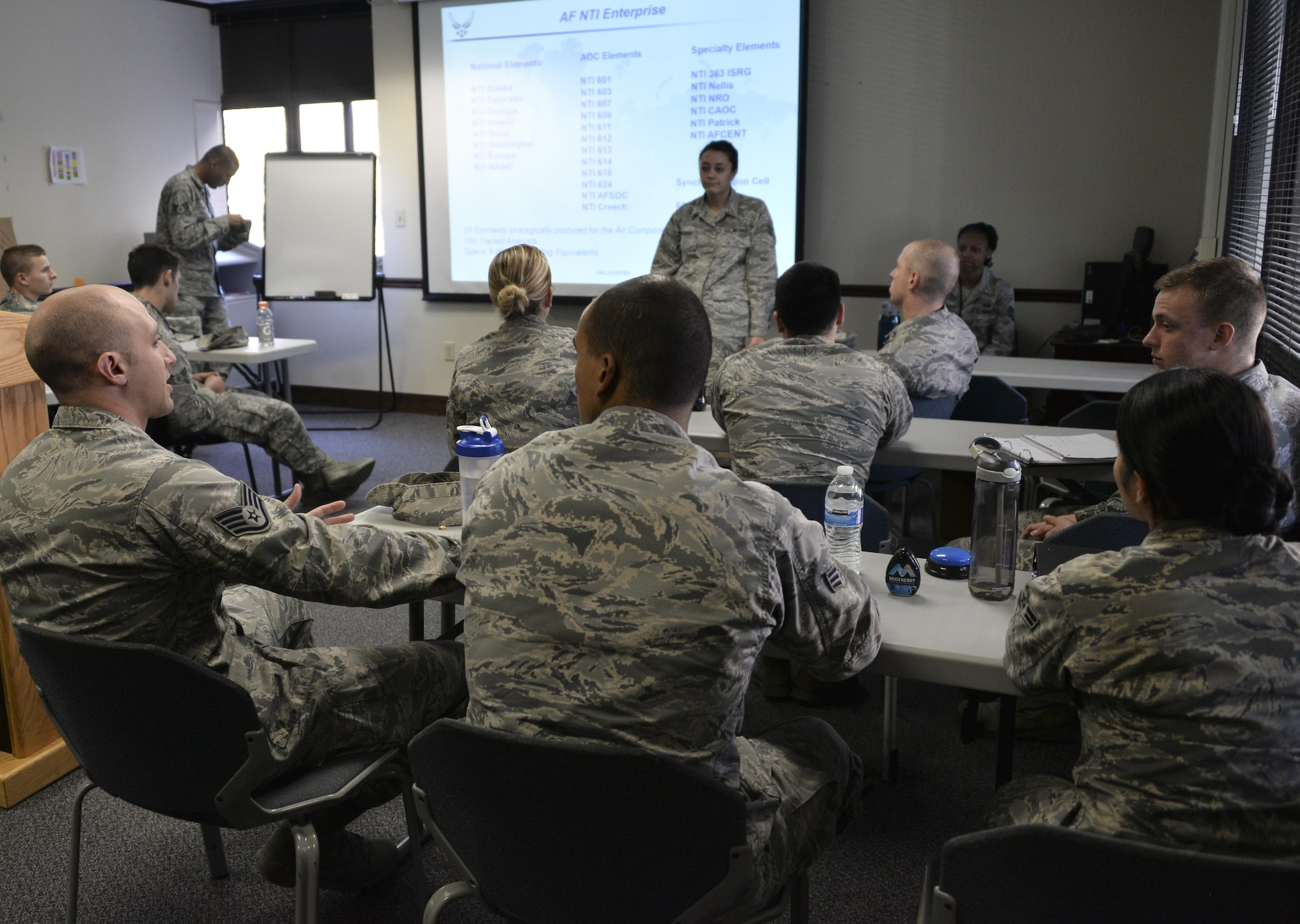 Airmen from the 70th Intelligence, Surveillance and Reconnaissance Wing discuss operational competencies during National Tactical Integration training November 4, 2016 at Fort Meade, Md. AF NTI works as an enterprise that collaborates to enhance Air Component operations around the world, as well as leveraging critical nation Intelligence Community information and capabilities. (U.S. Air Force photo/Staff Sgt. Alexandre Montes)