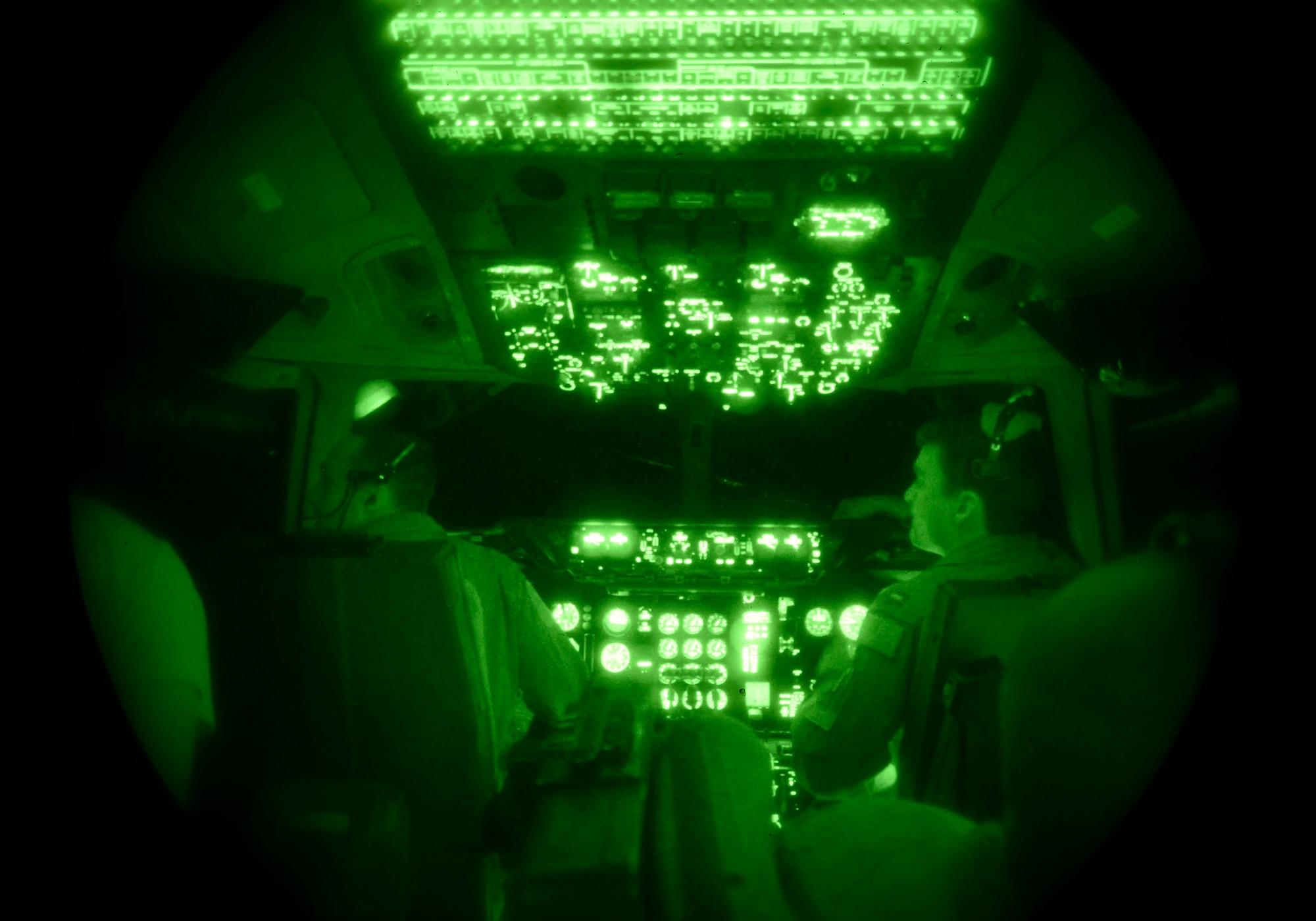1st Lt. Justin Greenway, 70th Air Refueling Squadron pilot, and 1st Lt. Mike Polito, 6th ARS pilot, fly a KC-10 extender aircraft during a refueling mission out of Luke Air Force Base, Ariz., Nov. 16, 2016. The KC-10, from Travis Air Force Base, Calif. flew in support of the F-16 pilot training mission. (U.S. Air Force photo by Senior Airman James Hensley)