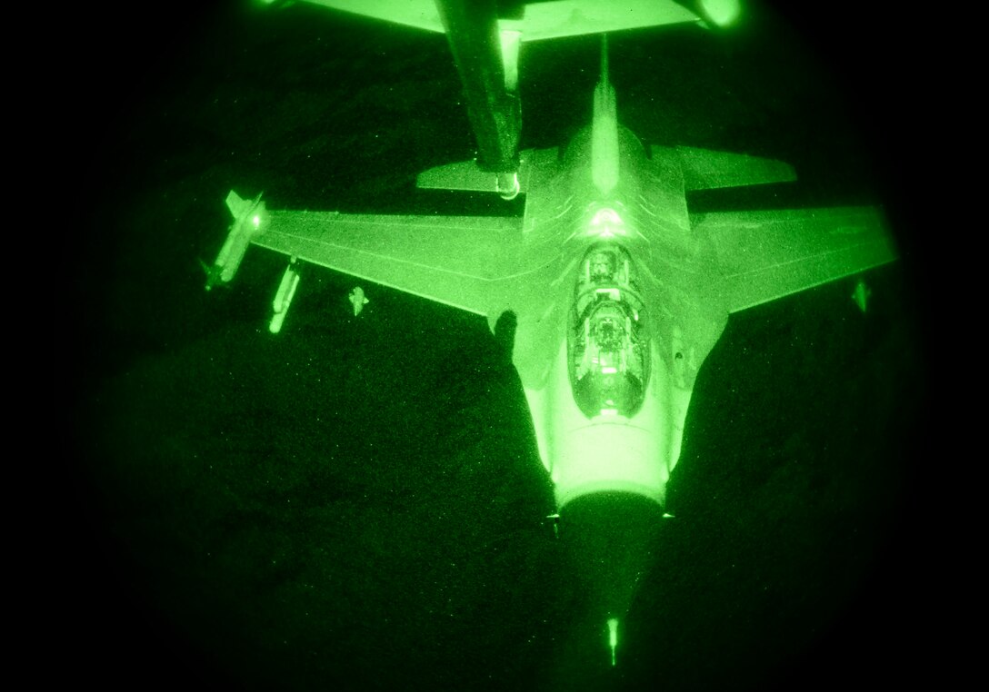 An F-16 Fighting Falcon approaches the boom of a KC-10 extender aircraft during an aerial refueling mission out of Luke Air Force Base, Ariz., Nov. 16, 2016. F-16 pilots train on aerial refueling operations to be prepared for longer mission requirements.  (U.S. Air Force photo by Senior Airman James Hensley)