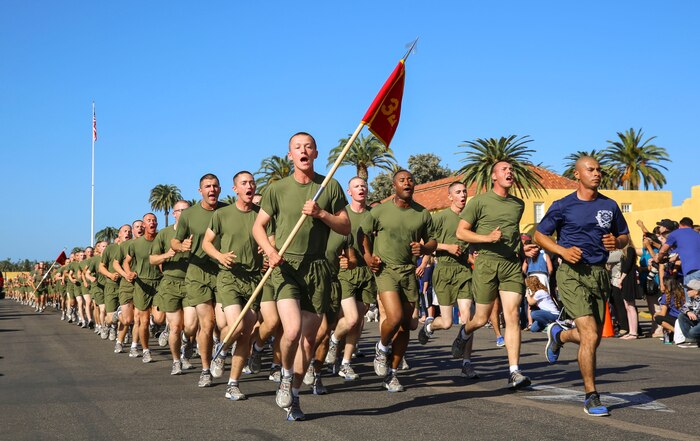 Marines with Mike Company, 3rd Recruit Training Battalion, run in formation during their motivational run at Marine Corps Recruit Depot San Diego, Nov. 17. The run serves as the last physical training event before graduation. Annually, more than 17,000 males recruited from the Western Recruiting Region are trained at MCRD San Diego. Mike Company is scheduled to graduate Nov. 18.