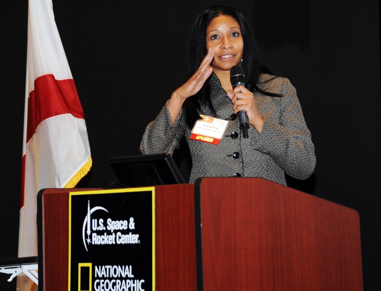 Porscha Porter, Huntsville Center’s Energy Division branch chief for Strategy and Business Management, moderates a panel focusing on federal government energy initiatives and partnerships during Energy Huntsville's Energy Summit Nov.15 at the U.S. Space and Rocket Center. 