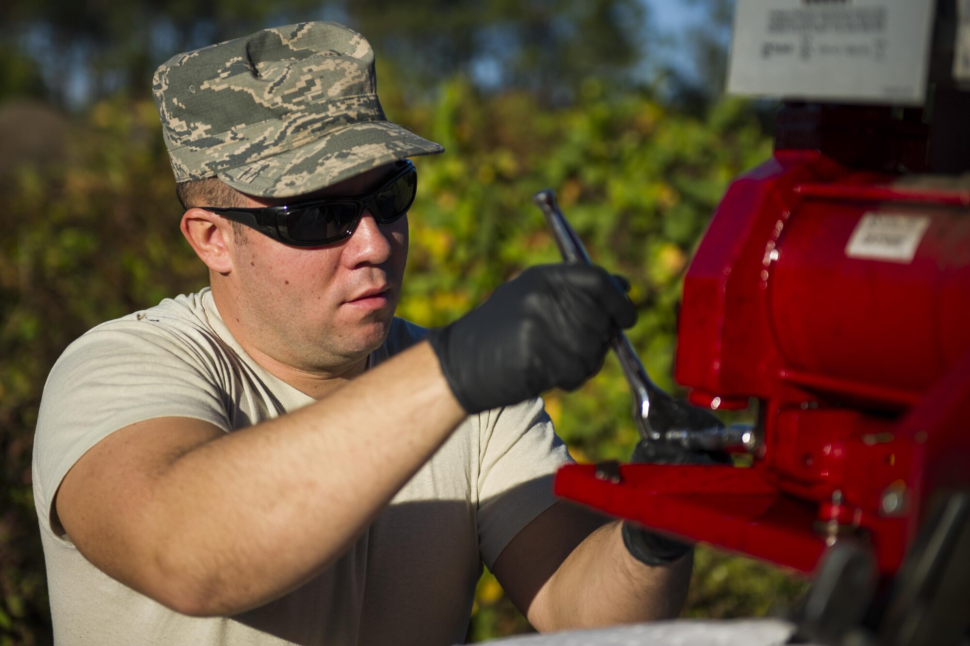 Senior Airman Dacota Napolitano, a water and fuels system specialist with the 1st Special Operations Civil Engineer Squadron, uses a socket wrench to install a fuel pump at Hurlburt Field, Fla., Nov. 17, 2016. The 1st SOCES replaced a fuel pump with a new one. (U.S. Air Force photo by Airman 1st Class Joseph Pick)