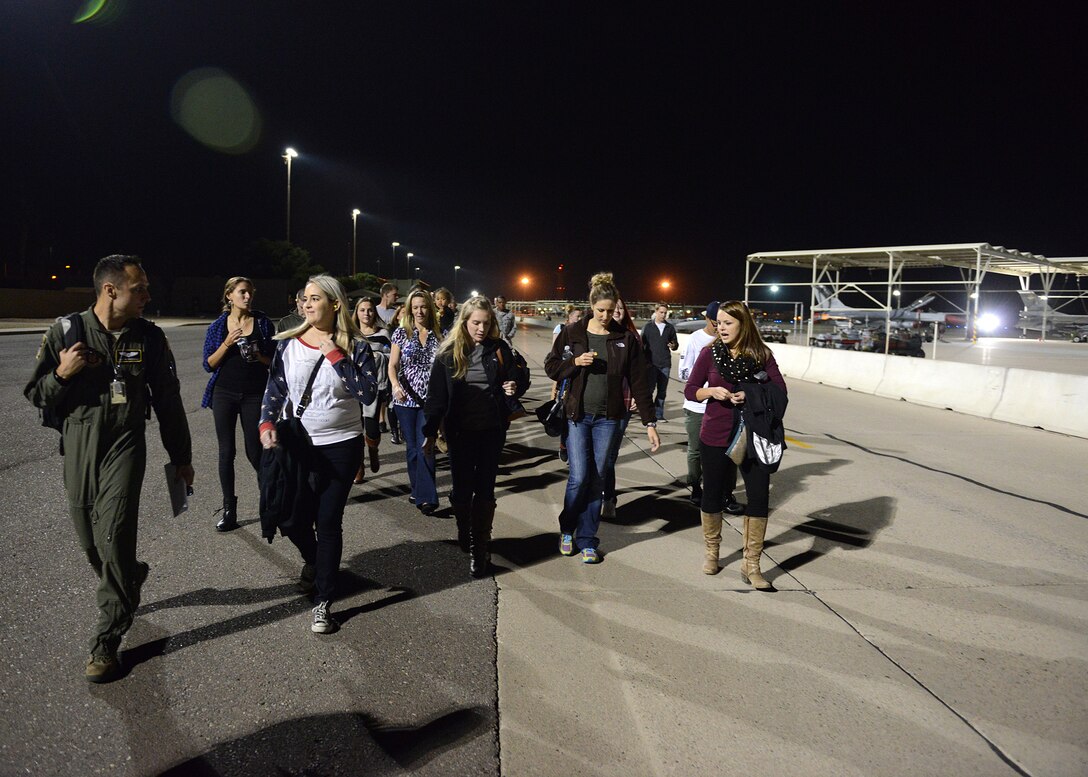 1st Lt. Justin Greenway, 70th Air Refueling Squadron pilot, leads a Junior Reserve Officer Training Corps group to a KC-10 Extender from Travis Air Force Base, Calif. Nov. 16, 2016 at Luke Air Force Base, Ariz. Members of the group were a part of JROTC and spouses of the pilots that flew the mission. (U.S. Air Force photo by Senior Airman Devante Williams)