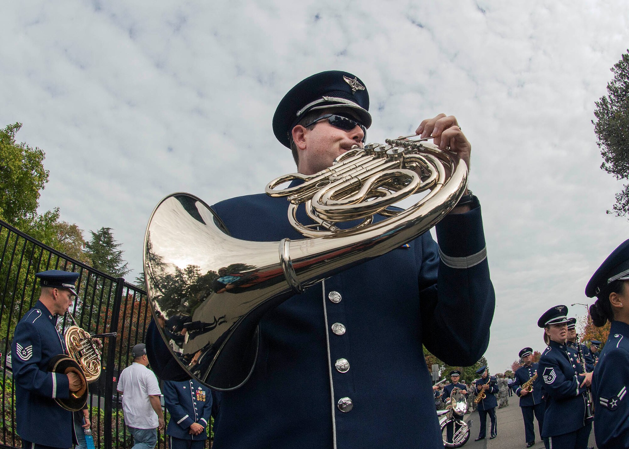 Senior Airman Daniel Nebel, U.S. Air Force Band of the Golden West, practices on his French horn as the band prepares to play in the Fairfield Veterans’ Day Parade Nov. 11, 2016.  There were 71 entries in this year’s parade which also included a formation of Airmen, a C-17 Globemaster III flyover the 60th Air Mobility Wing Commander, Col. John Klein Jr., served as the parades’ grand marshal.  (U.S. Air Force Photo by T.C. Perkins Jr.)