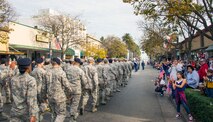Airmen from Travis Air Force Base, Calif., march down North Texas Avenue in  Fairfield Calif., Nov. 11, 2016, during the  city’s Veterans Day Commemoration and Parade celebration. The parade also featured performances from the U.S. Air Force Band of the Golden West and a C-17 Globemaster III flyover. ( (U.S. Air Force Photo by T.C. Perkins Jr.)  