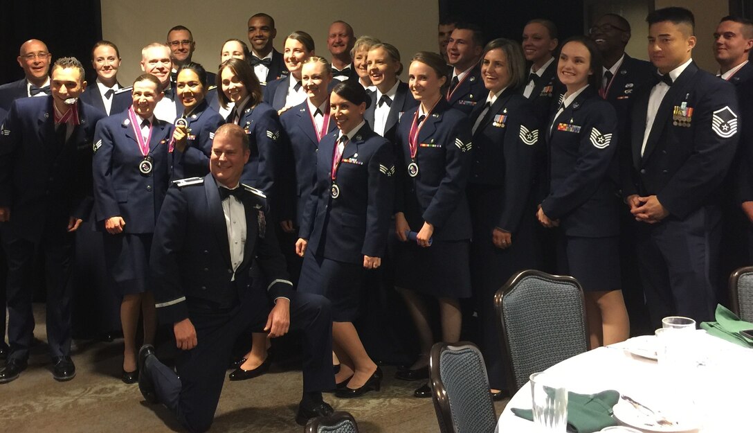 Col. James DeVere, front, 302nd Airlift Wing commander, joined others from the 302nd AW to congratulate the wing’s Airman Leadership School graduates from class 16-7, Oct. 13, 2016, here. During the graduation ceremony two Airmen from the 302nd AW were recognized for outstanding achievements. Senior Airman Elliot Jones, 302nd Civil Engineer Squadron, was presented with the academic achievement and distinguished graduate awards. Senior Airman Terrah Holmes, 302nd Aeromedical Staging Squadron, received the John L. Levitow honor graduate award. (Courtesy photo)