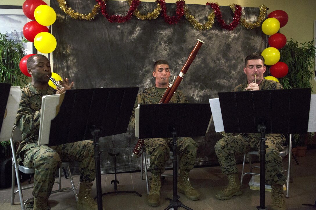 – Members of the III Marine Expeditionary Force Band perform live at the Marine Corps Air Station Futenma mess hall during the 241st Marine Corps Birthday celebration Nov. 9 on Marine Corps Air Station Futenma, Okinawa, Japan. The special meal of steak, lobster, and many other courses was one of the many traditional meals served on Marine Corps installations across Okinawa. During the celebration, patrons dug into each delicious course and enjoyed live music and a uniform pageant performed by Kubasaki High School Junior Reserve Officer Training Corps cadets. (U.S. Marine Corps photo by Cpl. Janessa K. Pon / Released)