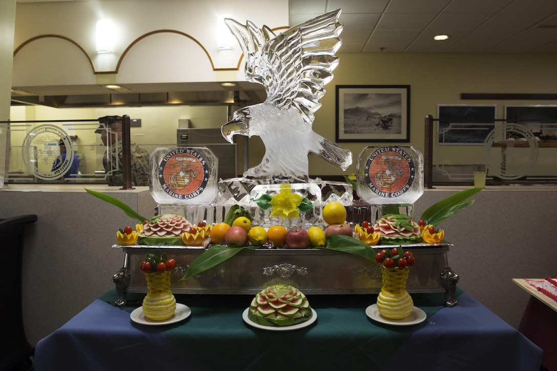 An ice sculpture of an eagle gleams on a display table during the 241st Marine Corps Birthday celebration at the Marine Corps Air Station Futenma mess hall Nov. 9 on MCAS Futenma, Okinawa, Japan. The meal was one of many served on Marine Corps installations across Okinawa that honors the Marine Corps Birthday by bringing Marines, families and base employees together to enjoy a special meal served by the mess hall. Patrons enjoyed a meal of many courses, such as steak, lobster, and shrimp; as well as live entertainment by the III Marine Expeditionary Force Band and a uniform pageant by Kubasaki High School Junior Reserve Officer Training Corps cadets. (U.S. Marine Corps photo by Cpl. Janessa K. Pon/ Released)