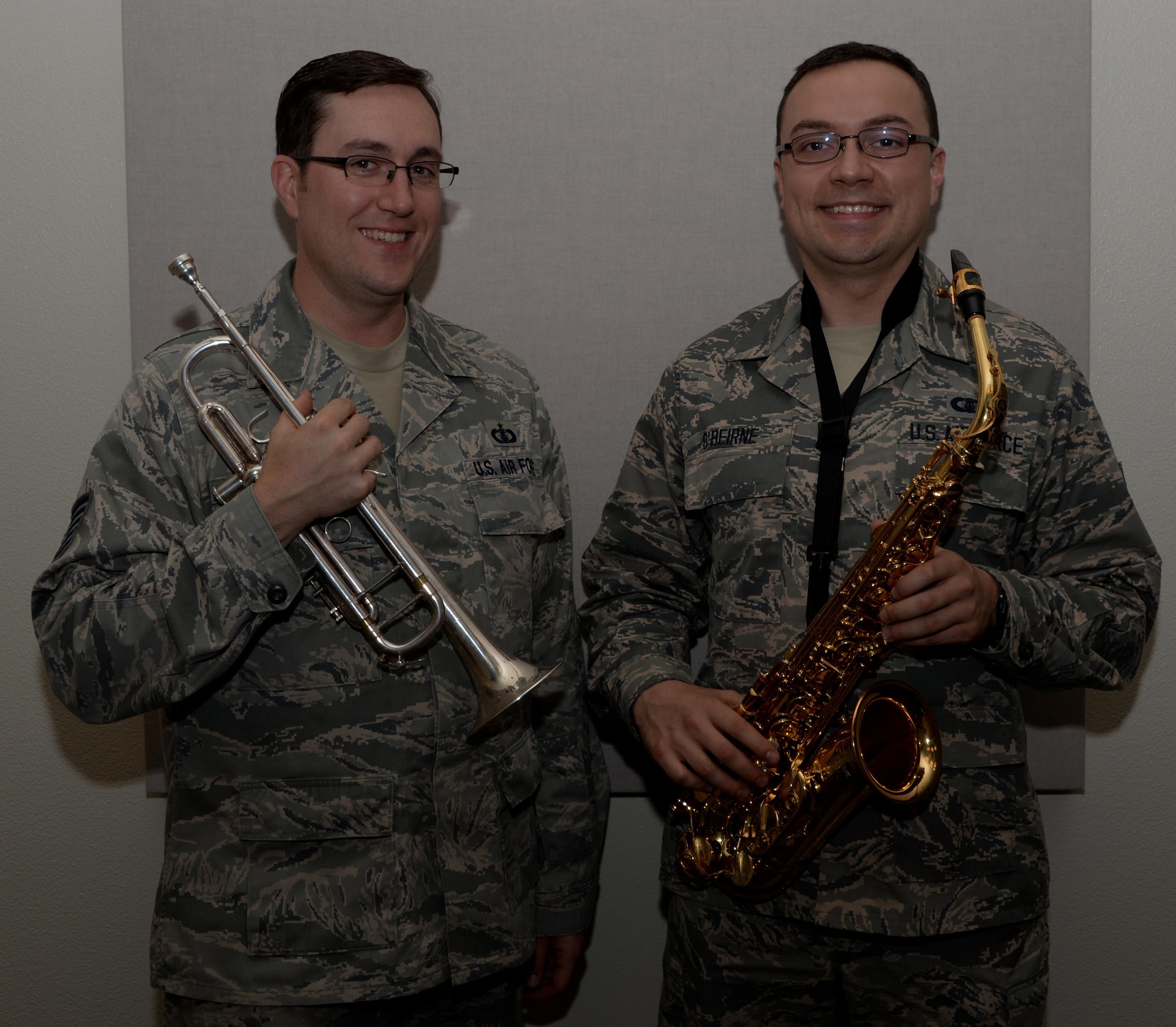 Tech. Sgt. Tom Salyers, (Left) U.S. Air Force Band of the Golden West Travis Brass Quintet noncommissioned officer in charge from Pittsburgh, Pennsylvania and Airman 1st Class, Ian O'Bierne, BOGW saxophonist from Pennsauken, New Jersey, pose for a photo at Travis Air Force Base, Calif., Nov. 15, 2016. Salyers and O'Bierne joined the band in July. (U.S. Air Force photo by Tech. Sgt. James Hodgman)