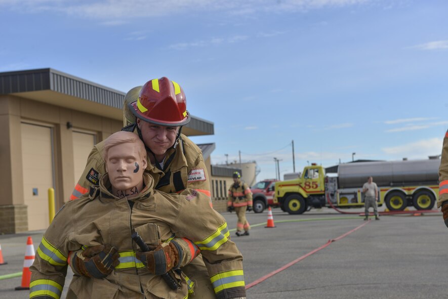 U.S. Air Force Airman 1st Class Nathan Bowland, a 354th Civil Engineer Squadron firefighter, pulls a dummy backward Sept. 8, 2016, at Eielson Air Force Base, Alaska. Bowland along with five other Airmen from the Eielson fire department trained in preparation for the Scott Safety Firefighter Combat Challenge world event. (U.S. Air Force photo by Airman Isaac Johnson)