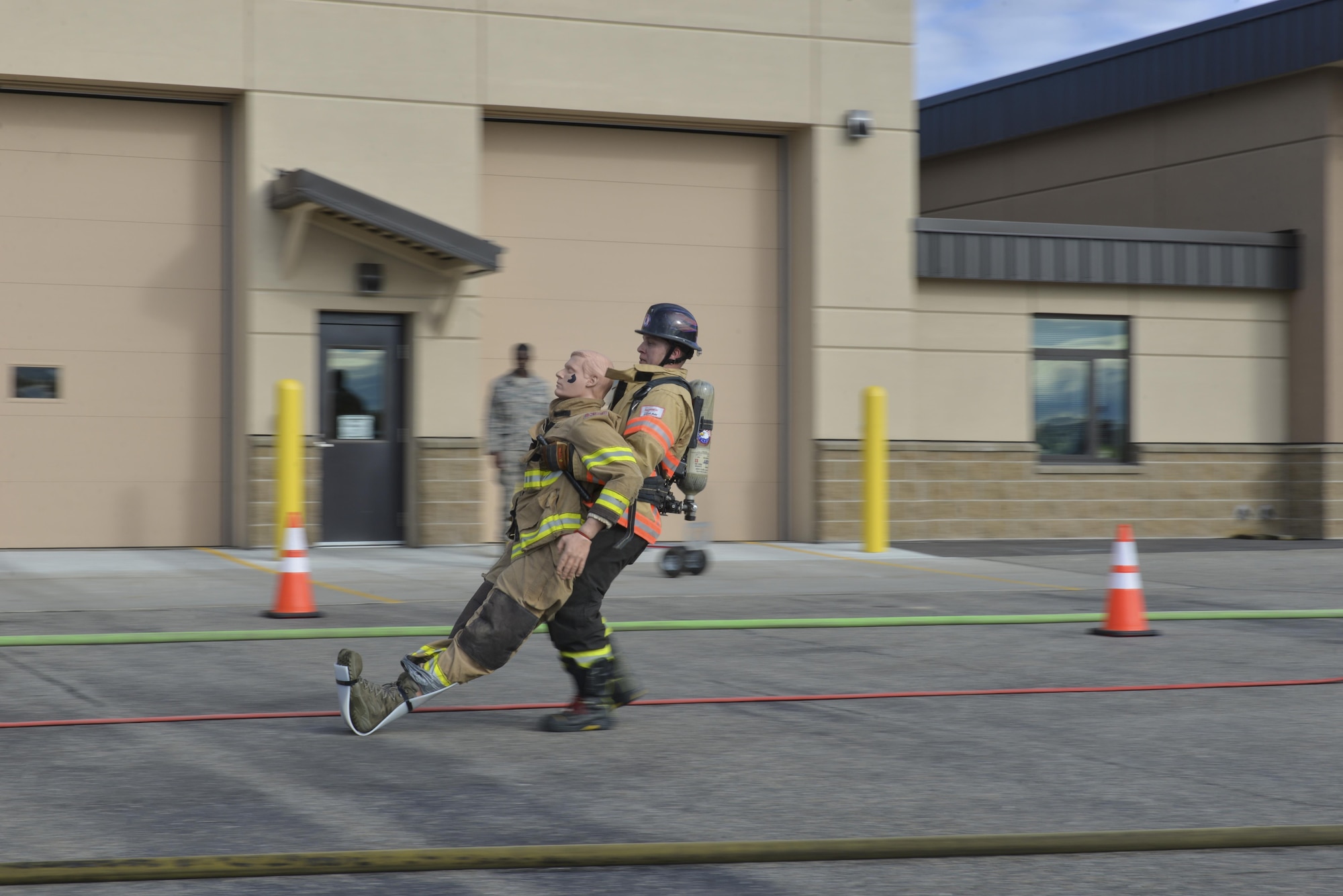 U.S. Air Force Staff Sgt. Christopher Johnson, a 354th Civil Engineer Squadron firefighter, swerves through cones Sept. 8, 2016, at Eielson Air Force Base, Alaska. The Eielson team from was the second fastest Department of Defense team. (U.S. Air Force photo by Airman Isaac Johnson)
