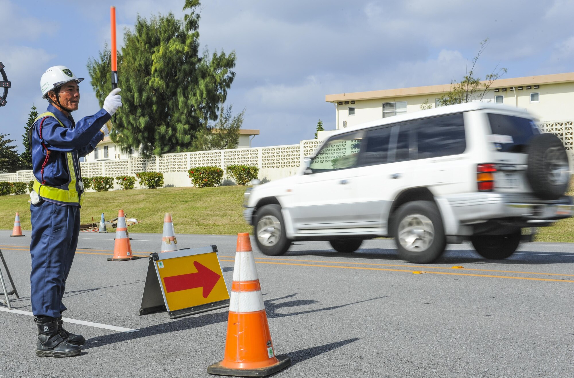 Yasuyuki Arashiro, a construction worker with Kochi Construction during the replacement of sewer pipes on Nov. 16, 2016, at Kadena Air Base, Japan. Due to the nature of the construction, parts of Kadena’s roads were dug up to replace pipelines below, leading to restricted travel routes for drivers. (U.S. Air Force photo by Airman 1st Class Nick Emerick/Released) 