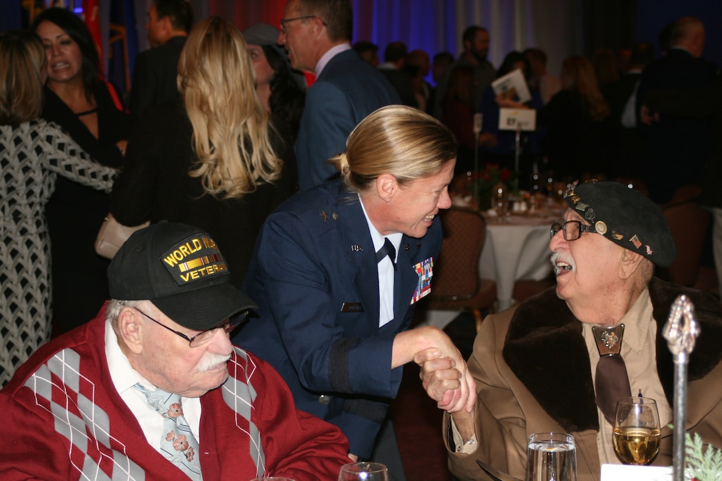 Brig. Gen. Christine Burckle, Utah Air National Guard Commander, visits with 
WWII veterans from the Central Utah Veterans Home during the National Ability 
Center Saluting Our Heroes Luncheon Nov. 16, 2016 at The Grand America Hotel. The 
National Ability Center in Park City, Utah, provides programs that empower 
injured service members to heal their minds, bodies and spirits through 
various recreation programs. (U.S. Air National Guard photo by Maj. Jennifer Eaton)
