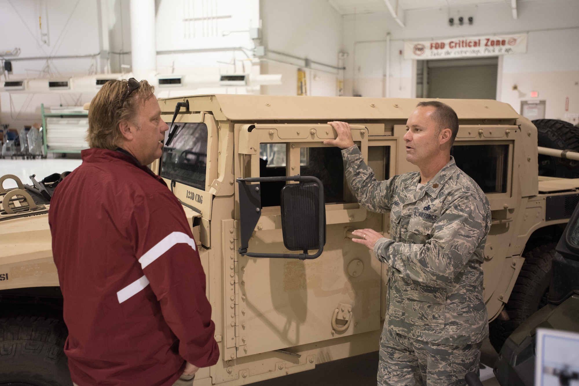 Maj. James Embry, director of operations for the 123rd Global Mobility Squadron, explains contingency response operations to Tom Raver, owner of Fireplace Distributors Inc., during an Employer Support of the Guard and Reserve “Bosslift” at the Kentucky Air National Guard Base in Louisville, Ky., Oct. 26, 2016. The Bosslift gave civilian employers an opportunity to learn more about what their employees do when serving as reservists in the Kentucky Air National Guard. (U.S. Air National Guard photo by Master Sgt. Phil Speck)