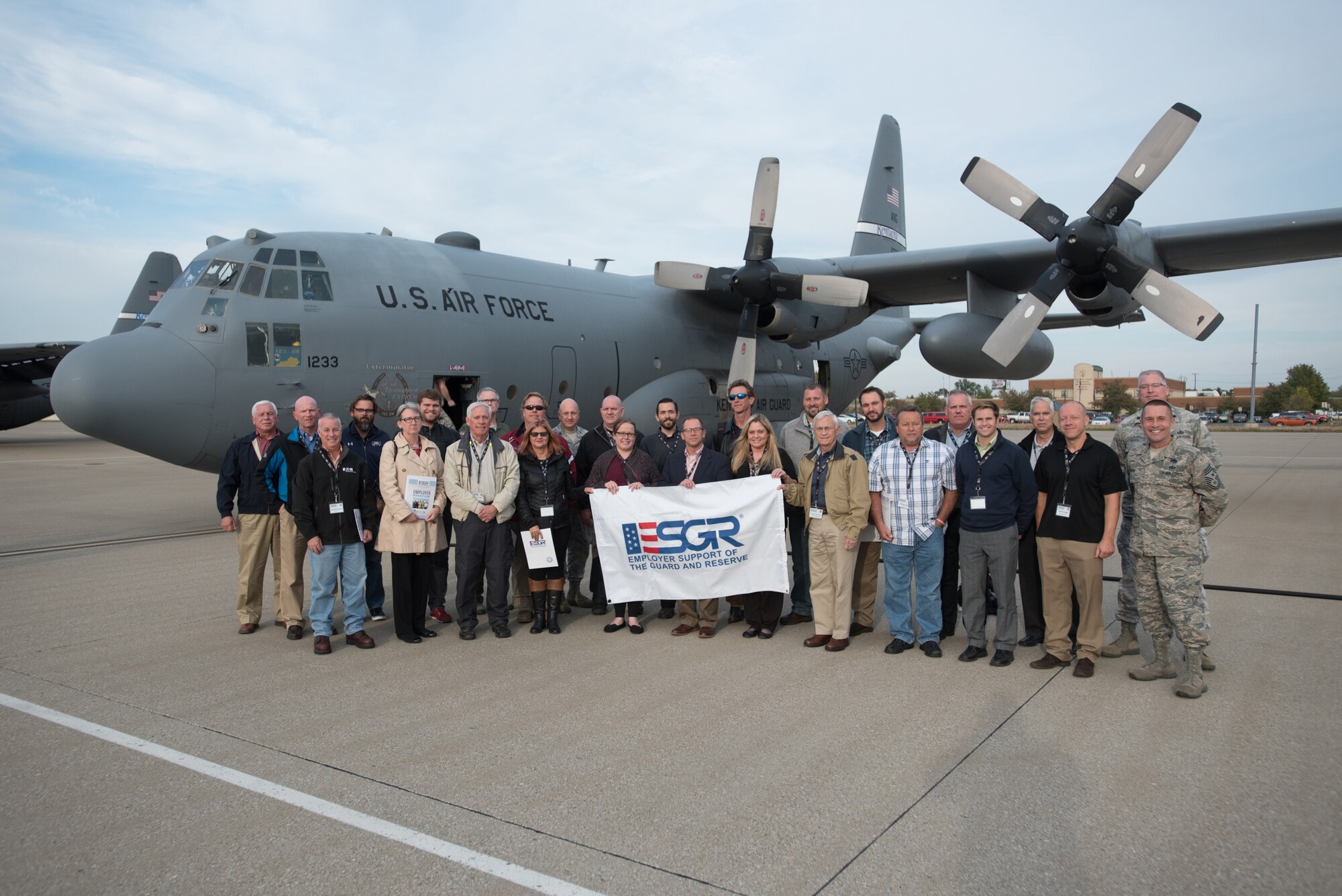 Nearly two-dozen civilian employers stand in front of a Kentucky Air National Guard C-130 aircraft with Airmen from the 123rd Airlift Wing and representatives of the Kentucky Committee for Employer Support of the Guard and Reserve at the Kentucky Air National Guard Base in Louisville, Ky., Oct. 26, 2016.  The employers were participating in an ESGR “Bosslift,” which enhances awareness and understanding between National Guardsmen and the civilian employers for whom they work when they’re not on duty. (U.S. Air National Guard photo by Master Sgt. Phil Speck)