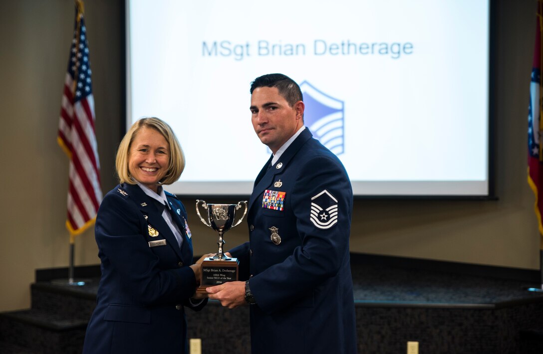 Master Sgt. Brian Detherage, 188th Security Forces Squadron, is awarded the 2016 Outstanding Senior Noncommissioned Officer of the Year award Nov. 5, 2016, at Ebbing Air National Guard Base, Fort Smith, Ark. The Outstanding Airman of the Year program promotes professional development, innovation and mission success by recognizing those who excel in their carrier fields while fostering the cultivation of ready, responsive and highly-skilled Airman. The award was presented to Detherage by Col. Bobbi Doorenbos, 188th Wing commander. (U.S. Air National Guard photo by Senior Airman Cody Martin)