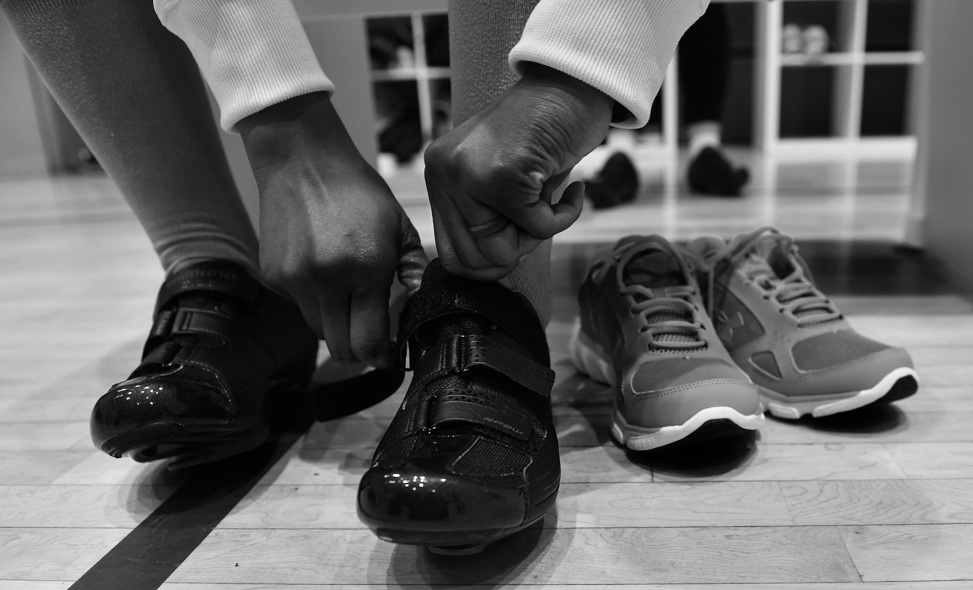 A participant of a United Service Organizations-hosted cycling class, SoulCycle, prepares herself before it starts at Ramstein Air Base, Germany, Nov. 15, 2016. Ramstein’s USO and the 86th Force Support Squadron hosted the indoor cycling classes as a method of keeping the exercise options in the Kaiserslautern Military Community refreshing and exciting. (U.S. Air Force photo by Airman 1st Class Lane T. Plummer)