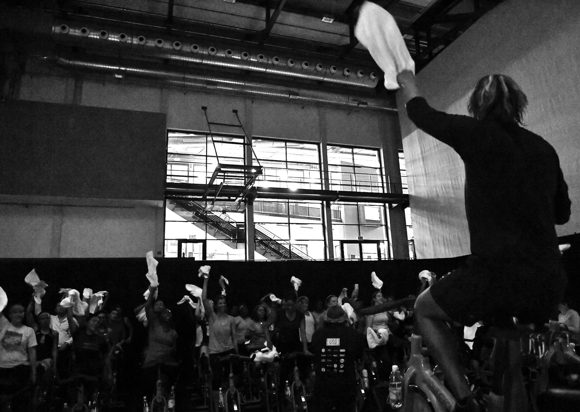 Tomas Mikzus, SoulCycle instructor, marks the halfway point of an exercise during a United Service Organizations-hosted cycling class, SoulCycle, at Ramstein Air Base, Germany, Nov. 15, 2016. Participants rode stationary bicycles in rhythm with their instructors, moving through several exercises. (U.S. Air Force photo by Airman 1st Class Lane T. Plummer)