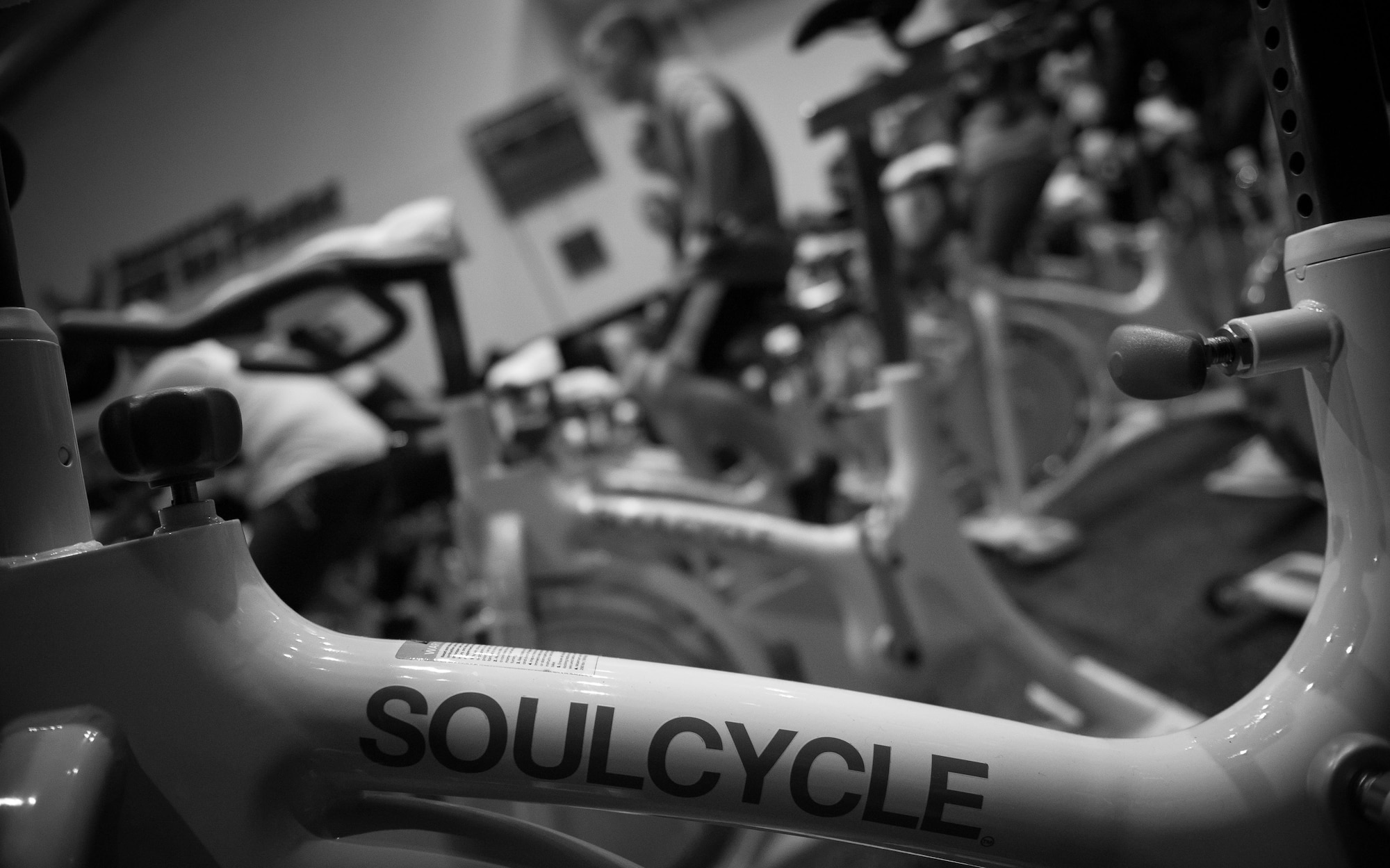 Participants of a United Service Organizations-hosted cycling class, SoulCycle, warm up prior to the start of the event at Ramstein Air Base, Germany, Nov. 15, 2016. Dozens of stationary bicycles were in compact rows within the small room. (U.S. Air Force photo by Airman 1st Class Lane T. Plummer)