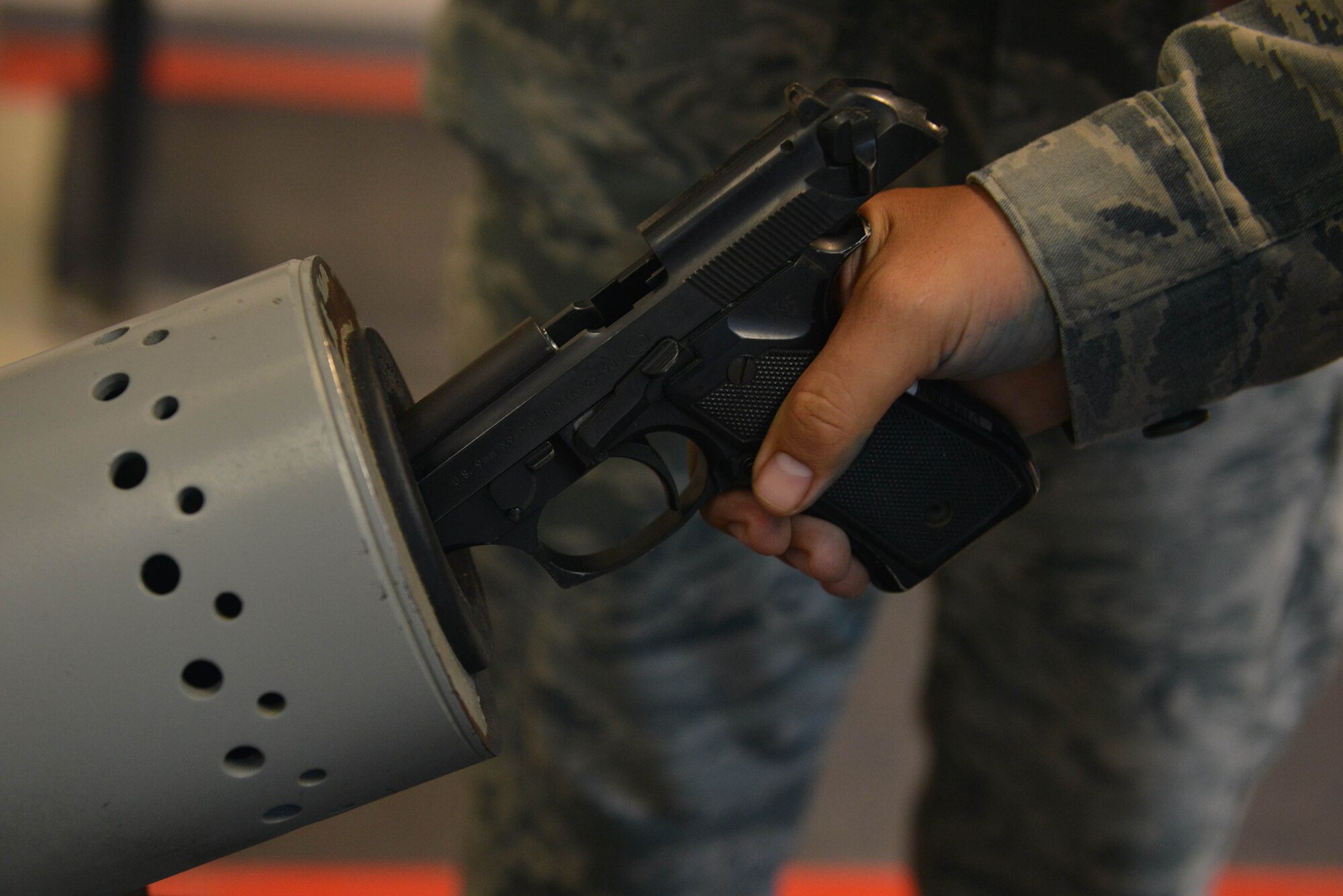 A U.S. Airman assigned to the 39th Security Forces Squadron clears an M9 pistol July 20, 2016, at Incirlik Air Base, Turkey. Security Forces Airmen are responsible for administering law enforcement and base defense. (U.S. Air Force photo by Senior Airman John Nieves Camacho)