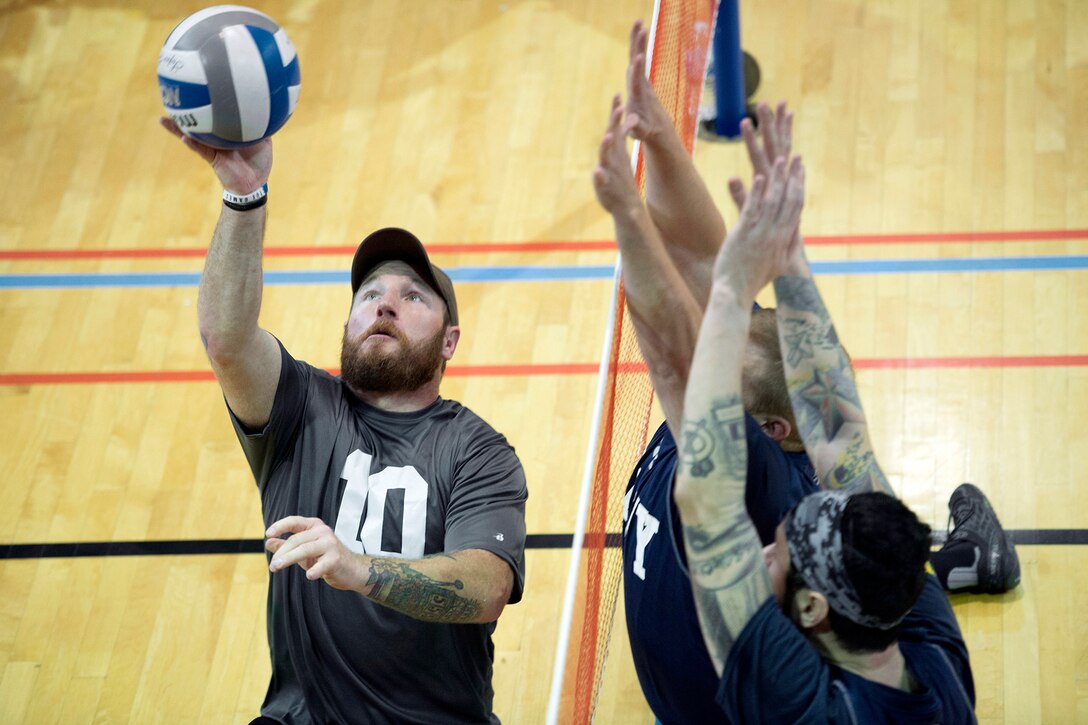 Special Operations Command Team’s Josh Lindstrom hits a ball during the 2016 Warrior Care Month Joint Service Sitting Volleyball Tournament at the Pentagon in Arlington, Va., Nov. 19, 2016. DoD photo by EJ Hersom