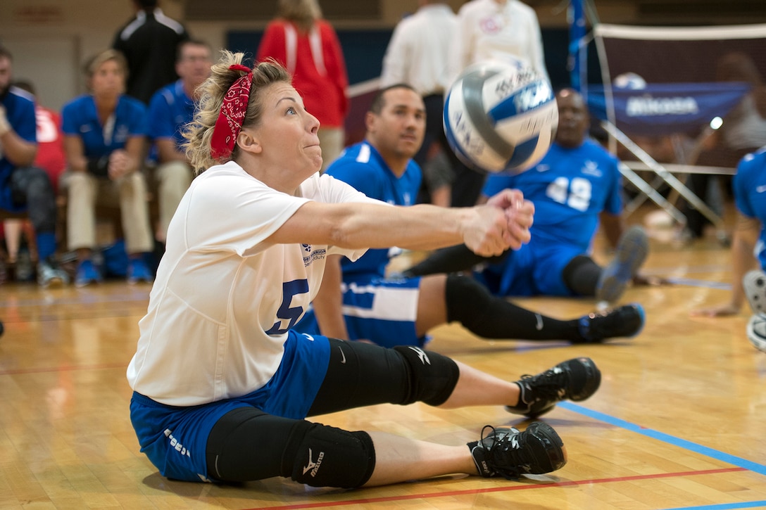 Air Force Tech. Sgt. Jessica Moore bumps a serve during the 2016 Warrior Care Month Joint Service Sitting Volleyball Tournament at the Pentagon, Nov. 19, 2016. DoD photo by EJ Hersom