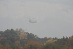 A South Carolina Army National Guard CH-47 Chinook from Det. 1, Bravo Company, 2-238th General Support Aviation Battalion with Soldiers from Donaldson Field in Greenville, South Carolina, responded to a request for help from the South Carolina Forestry Commission to contain fires burning near the top of Pinnacle Mountain in in Pickens County, South Carolina, Nov. 15, 2016.  The aircraft is equipped with a Bambi Bucket, which can be filled with any available water to be transported and dumped on the fire. 