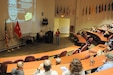 FORT MCCOY, Wisconsin (November 17, 2016) – Bella Hernandez, center, a special agent with the 752nd Military Intelligence Battalion, speaks to a crowd of Soldiers and civilians from the 88th Regional Support Command and Fort McCoy during the Threat Awareness and Reporting Program (TARP) training at the Blue Devil Auditorium in the 88th RSC headquarters, November 17.