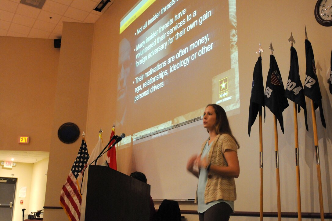 FORT MCCOY, Wisconsin (November 17, 2016) – Jaymee Eckert, a special agent with the U.S. Army Reserve’s 752nd Military Intelligence Battalion, speaks to Soldiers and civilians of the 88th Regional Support Command and Fort McCoy during a Threat Awareness and Reporting Program (TARP) training at the Blue Devil Auditorium in the 88th RSC headquarters, November 17.