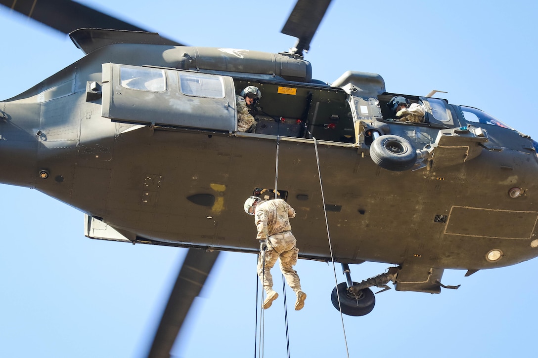 Army students attending the DeGlopper Air Assault School rappel from a UH-60M Black Hawk helicopter at Fort Bragg, N.C., Nov. 17, 2016. Army photo by Sgt. Steven Galimore