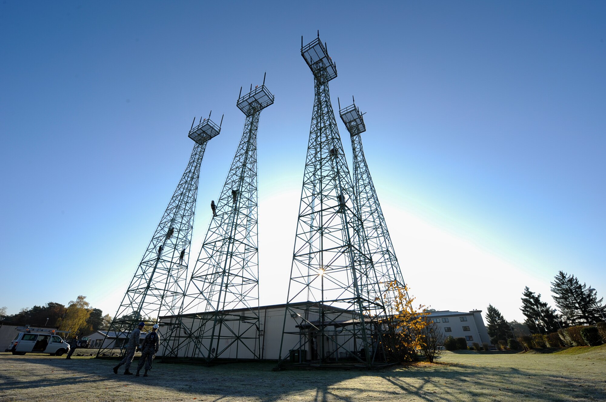Airmen from the 86th Operations Support Squadron climb air traffic control radio antennas at Ramstein Air Base, Germany, Nov. 14, 2016. The Air Traffic Control and Landing Systems flight regularly checks all Instrument Landing System’s parameters to ensure the antenna towers and monitors are performing correctly.(U.S. Air Force photo by Airman 1st Class Savannah L. Waters)