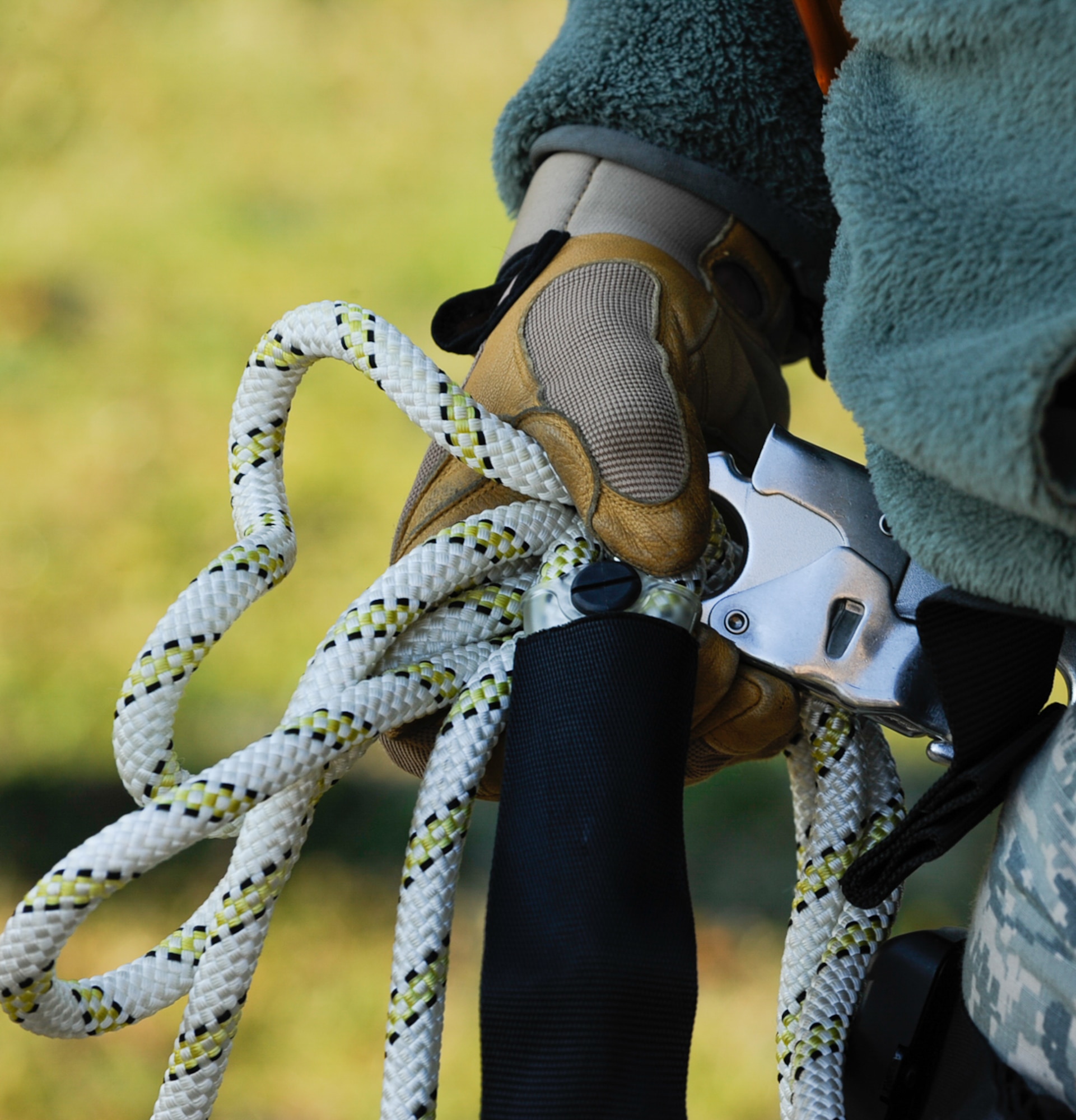 Senior Airman Mathew Godec, 86th Operations Support Squadron airfield systems technician, bundles excess rope at Ramstein Air Base, Germany, Nov. 14, 2016. This equipment is used to assist 86th OSS Airmen in climbing air traffic control radio antennas across the base to keep the airfield open and the Instrument Landing Systems in compliance with the Federal Aviation Administration and International Civil Aviation Organization standards.  (U.S. Air Force photo by Airman 1st Class Savannah L. Waters)