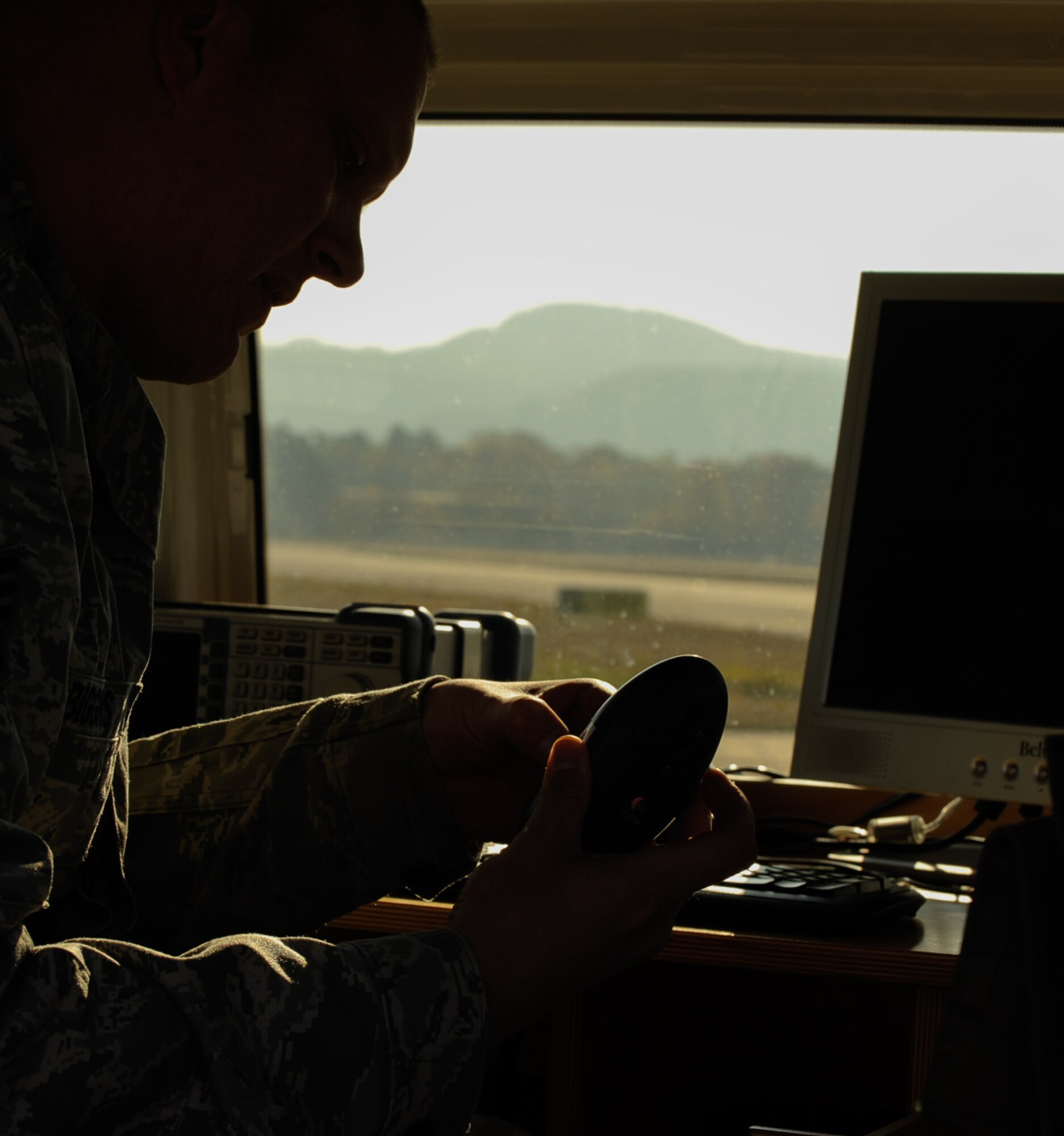 Tech. Sgt. Richard Biggins, 86th Operations Support Squadron airfield systems NCO in charge, inspects a portable instrument landing system receiver at Ramstein Air Base, Germany, Nov. 14, 2016. The Air Traffic Control and Landing Systems flight uses a specially built test vehicle to drive the length of the runway multiple times with an antenna 12 meters in height to simulate an aircraft and ensure the signals are being brought directly down the centerline. This system is a zero visibility-auto land system that requires additional checks to verify the system is performing as required. (U.S. Air Force photo by Airman 1st Class Savannah L. Waters)