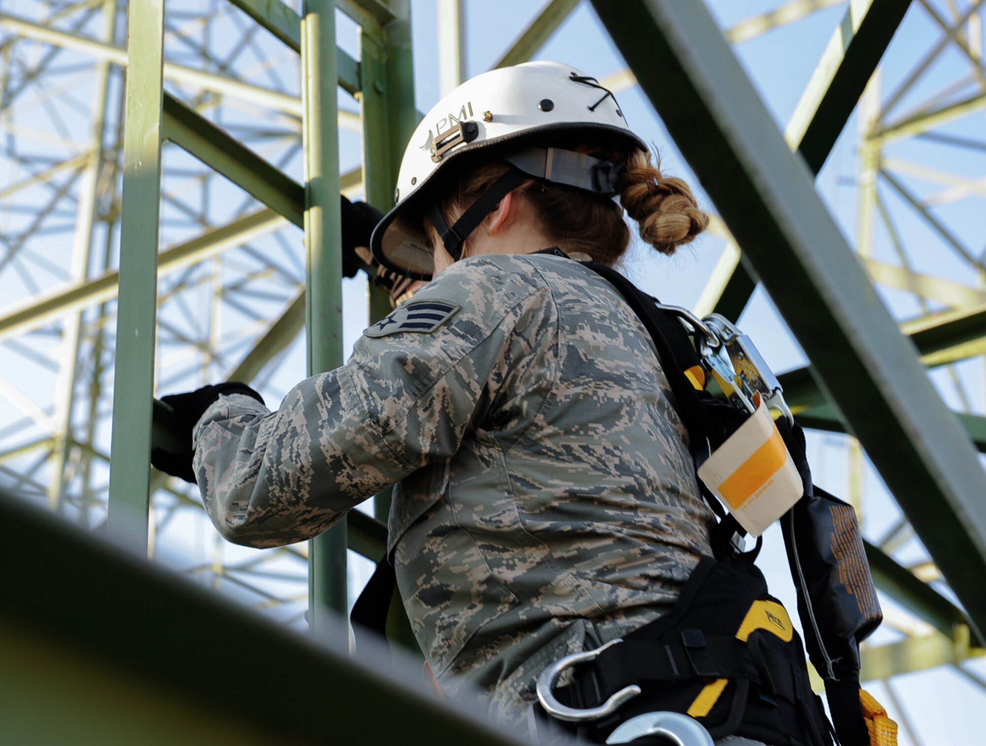 Senior Airman Nikki Erling, 86th Operations Support Squadron airfield systems technician, climbs air traffic control radio antennas at Ramstein Air Base, Germany, Nov. 14, 2016. The 86th OSS performs visual inspection of the Navigational Aids and on the ground measurements to ensure the equipment is working. (U.S. Air Force photo by Airman 1st Class Savannah L. Waters)