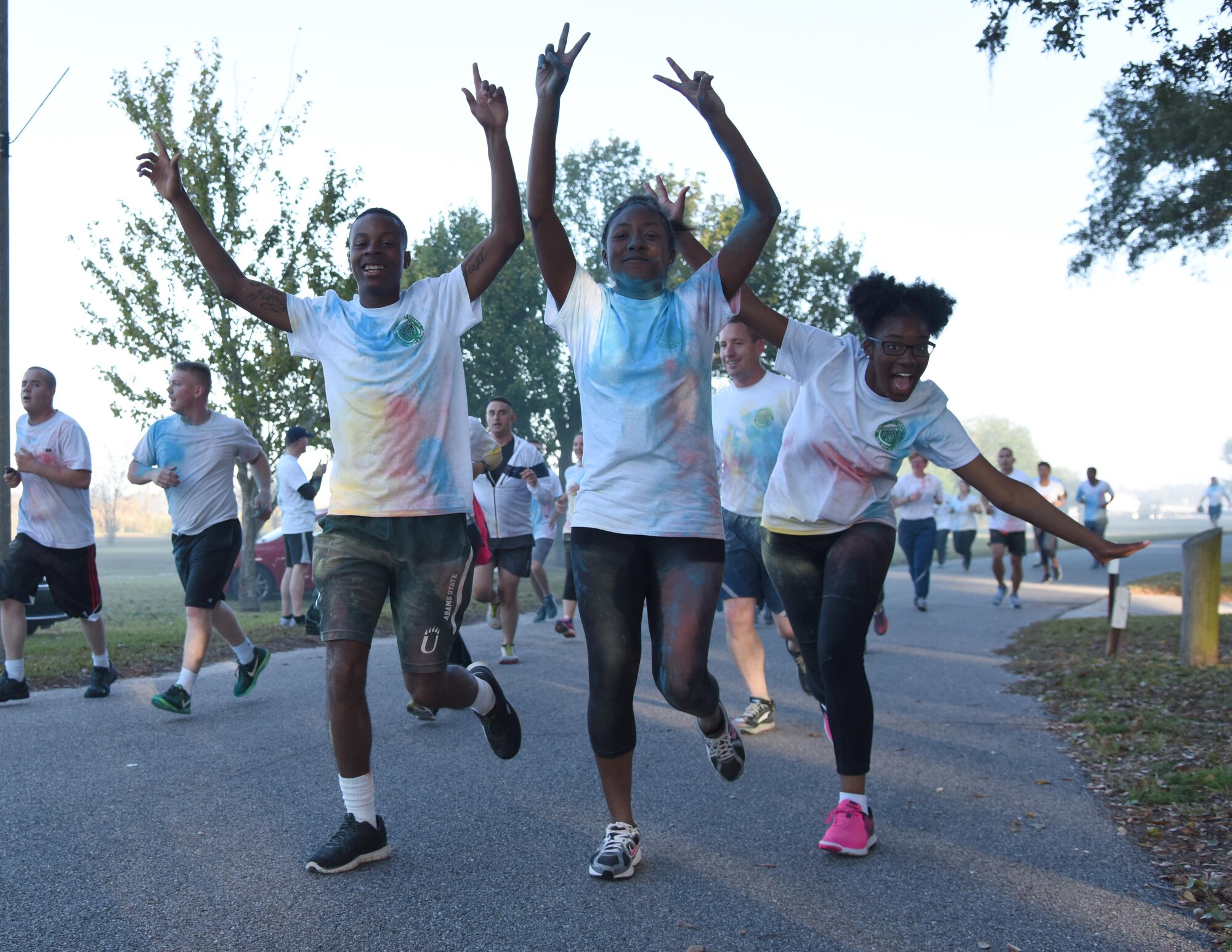 Keesler personnel participate in an 81st Training Wing color run at the Marina Park Nov. 17, 2016, on Keesler Air Force Base, Miss. The run was one of several events held throughout Dragon Week, which focuses on resiliency and teambuilding initiatives across the base. (U.S. Air Force photo by Kemberly Groue/Released)