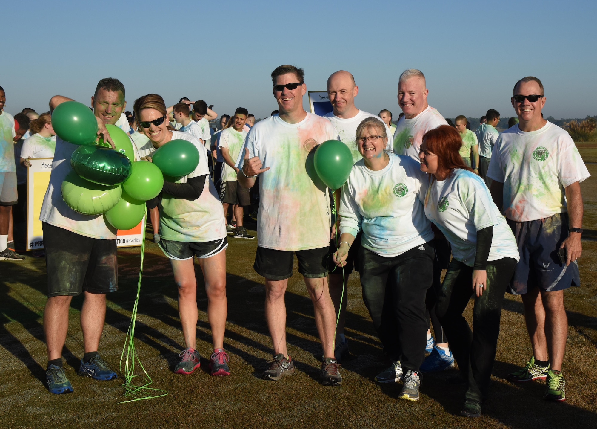 Leadership from the 81st Training Wing pose for a group photo following a Wing color run at the Marina Park Nov. 17, 2016, on Keesler Air Force Base, Miss. The run was one of several events held throughout Dragon Week, which focuses on resiliency and teambuilding initiatives across the base. (U.S. Air Force photo by Kemberly Groue/Released)
