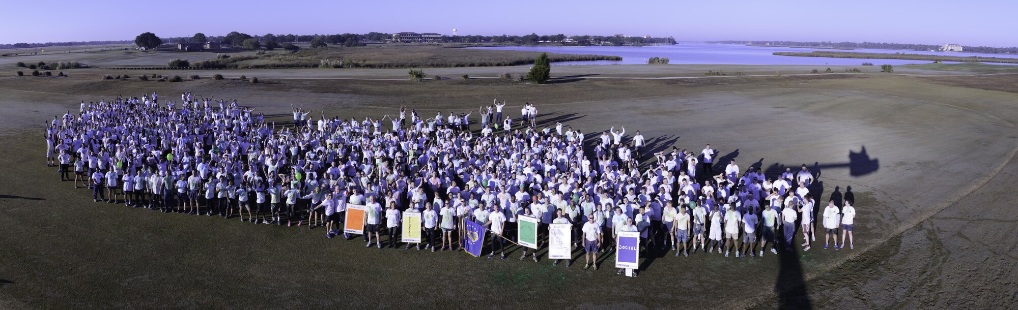 Keesler personnel pose for a group photo during the 81st Training Wing color run at the Marina Park Nov. 17, 2016, on Keesler Air Force Base, Miss. The run was one of several events held throughout Dragon Week, which focuses on resiliency and teambuilding initiatives across the base. (U.S. Air Force photo by André Askew/Released)