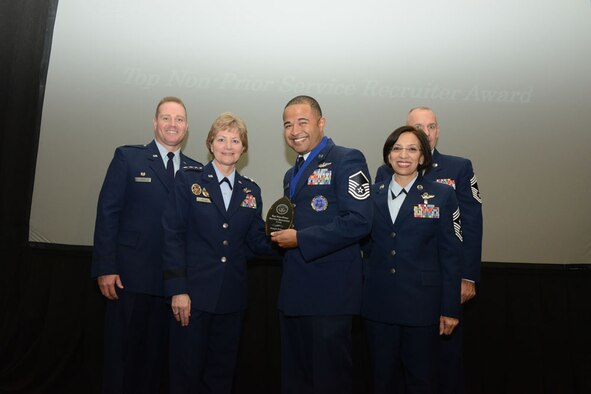 ORLANDO, Florida – Air Force Reserve Line Recruiter Master Sgt. Joseph Poltor (center) stands with a group including Air Force Reserve Commander Lt. Gen. Maryanne Miller (left center) and Air Force Reserve Command Chief Master Sgt. Ericka Kelly (right center) during a ceremony at the annual Air Force Reserve Recruiting Conference here, Oct. 27, 2016. Poltor was given the Air Force Reserve Top Non-Prior Service Recruiter Award at the conference. (U.S. Air Force photo/Master Sgt. Chance Babin)