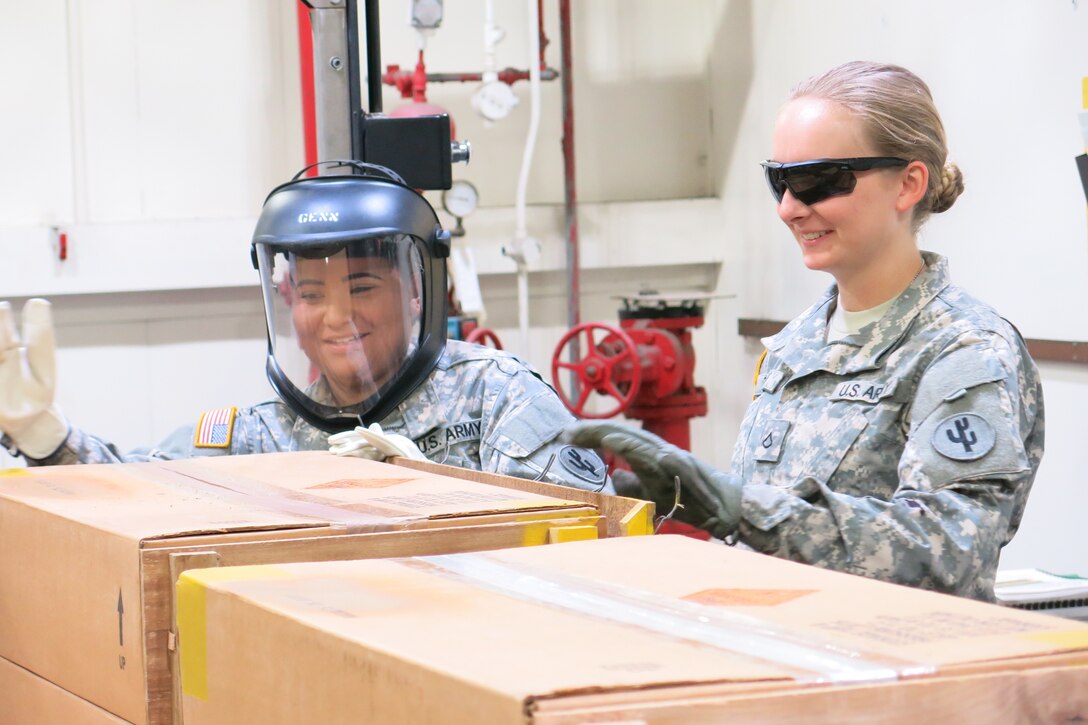 Reservists from the 351st and 826th Ordnance Companies work inspection operations on July 12, 2016, in support of outload operations.