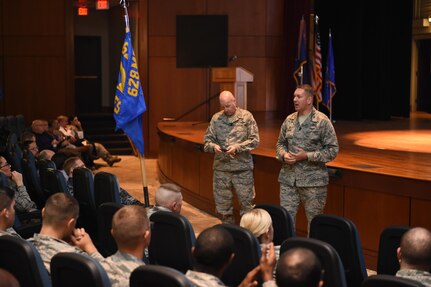Col. Robert Lyman, 628th Air Base Wing commander, right, and Chief Master Sgt. Todd Cole, 628th Air Base Wing command chief, left, answer questions during a commander’s call in the Air Base Theater Nov. 17, 2016. During the commander's call, Lyman recognized several individuals for recent accomplishments and spoke to how well the members of the base handled the Hurricane Matthew evacuation efforts.