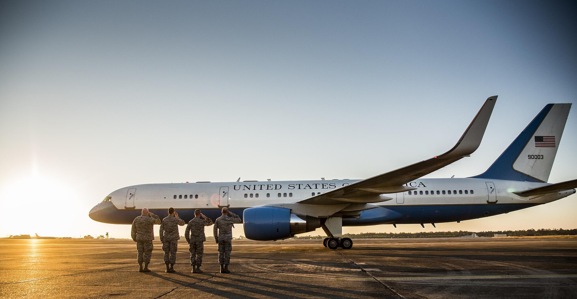 Base leadership salute as Secretary of Defense Ash Carter’s aircraft begins to taxi out after a visit to Eglin Air Force Base, Fla. Nov. 17.  Carter visited numerous locations around Eglin and Hurlburt Field during his day tour of the local area. (U.S. Air Force photo/Samuel King Jr.)