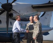 Secretary of Defense Ash Carter greets Brig. Gen. Christopher Azzano and Chief Master Sgt. Brian Creager, 96th Test Wing commander and command chief respectively, upon arrival for a visit to Eglin Air Force Base, Fla. Nov. 17.  Carter visited numerous locations around Eglin and Hurlburt Field during his day tour of the local area. (U.S. Air Force photo/Samuel King Jr.)
