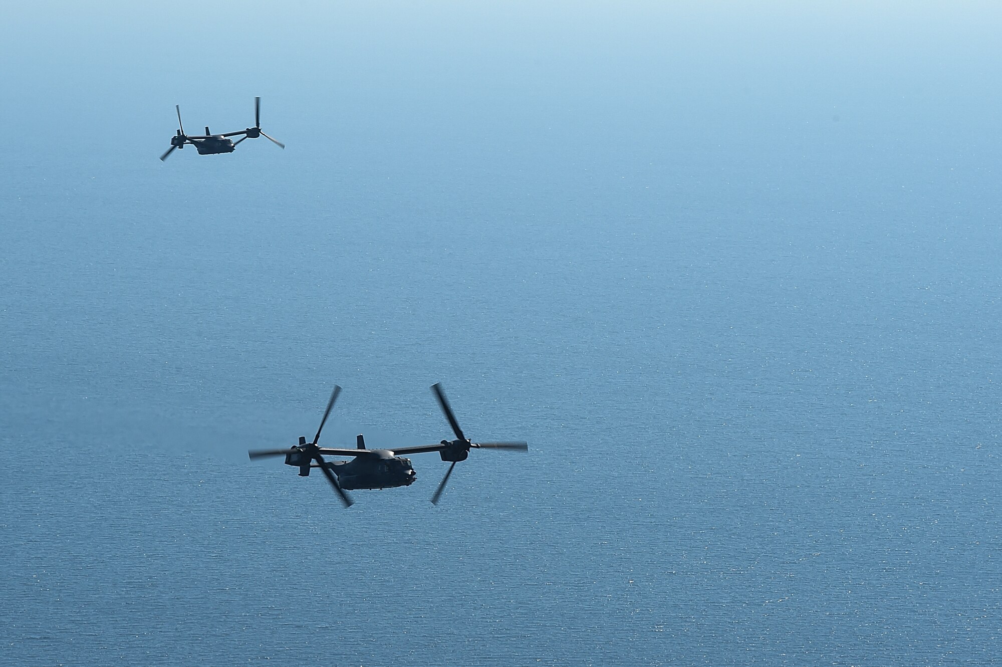 Two CV-22 Osprey tiltrotor aircraft assigned to the 8th Special Operations Squadron make their approach for a tiltrotor air-to-air refueling with an MC-130H Combat Talon II aircraft assigned the 15th SOS over the Gulf of Mexico, Nov. 17, 2016. The 8th and 15th SOS participated in a TAAR demonstration for Secretary of Defense Ash Carter during his visit to Hurlburt Field, Fla. (U.S. Air Force photo by Senior Airman Jeff Parkinson)
