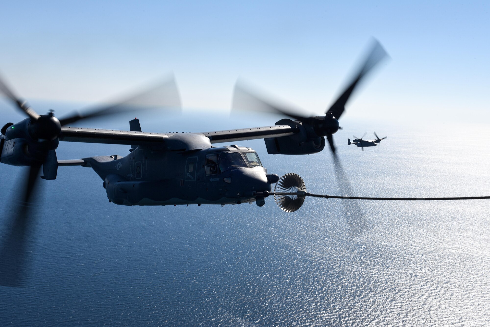 A CV-22 Osprey tiltrotor aircraft assigned to the 8th Special Operations Squadron receives fuel from an MC-130H Combat Talon II aircraft assigned the 15th SOS over the Gulf of Mexico, Nov. 17, 2016. The 8th and 15th SOS participated in a TAAR demonstration for Secretary of Defense Ash Carter during his visit to Hurlburt Field, Fla. (U.S. Air Force photo by Senior Airman Jeff Parkinson)