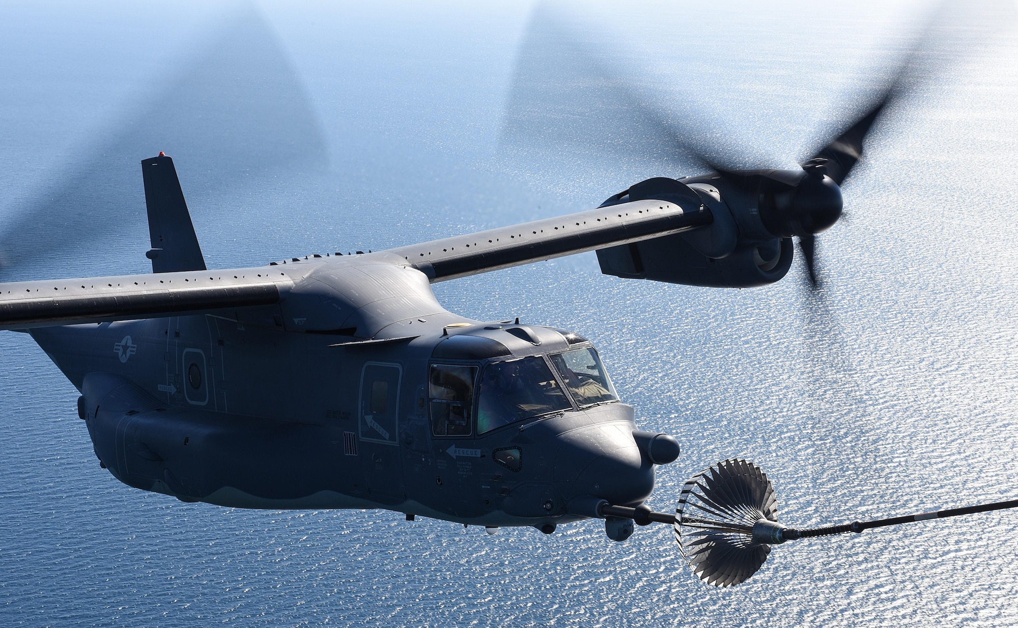 A CV-22 Osprey tiltrotor aircraft assigned to the 8th Special Operations Squadron receives fuel from an MC-130H Combat Talon II aircraft assigned the 15th SOS over the Gulf of Mexico, Nov. 17, 2016. The 8th and 15th SOS participated in a tiltrotor air-to-air refueling demonstration for Secretary of Defense Ash Carter during his visit to Hurlburt Field, Fla. (U.S. Air Force photo by Senior Airman Jeff Parkinson)