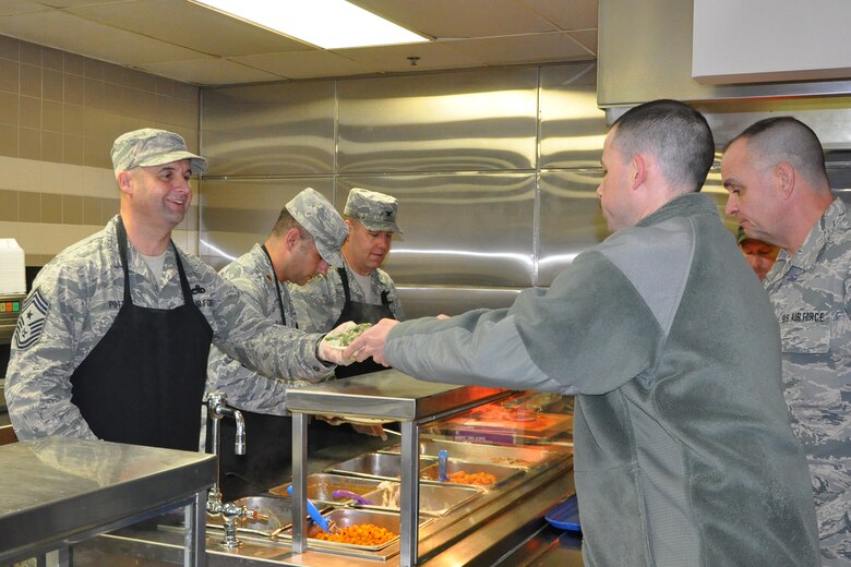 910th Airlift Wing Command Chief Master Sgt. Robert Potts serves a Thanksgiving lunch to a Citizen Airman at the Community Activity Center here, Nov. 5, 2016. Wing leadership serving a Thanksgiving meal to 910th members during the November Unit Training Assembly is a long-standing tradition at YARS. (U.S. Air Force photo/Master Sgt. Bob Barko Jr.)