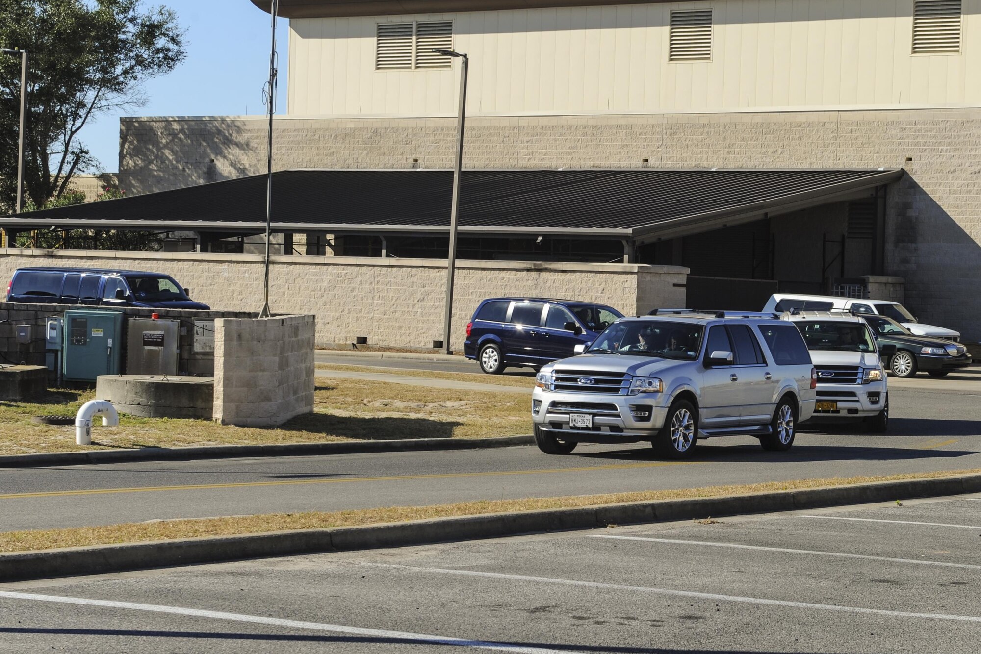 The motorcade of Secretary of Defense Ash Carter arrives at the 8th Special Operations Squadron building for a pre-flight brief on Hurlburt Field, Fla., Nov. 17, 2016. During his flight, Carter experienced a tiltrotor air-to-air refueling with an MC-130H Combat Talon II assigned to the 15th SOS. During his time at Hurlburt Field, he also visited with Air Force Special Operations Command Air Commandos and participated in a Joint Assault Force with Special Tactics teams. (U.S. Air Force photo by Staff Sgt. Kentavist Brackin)