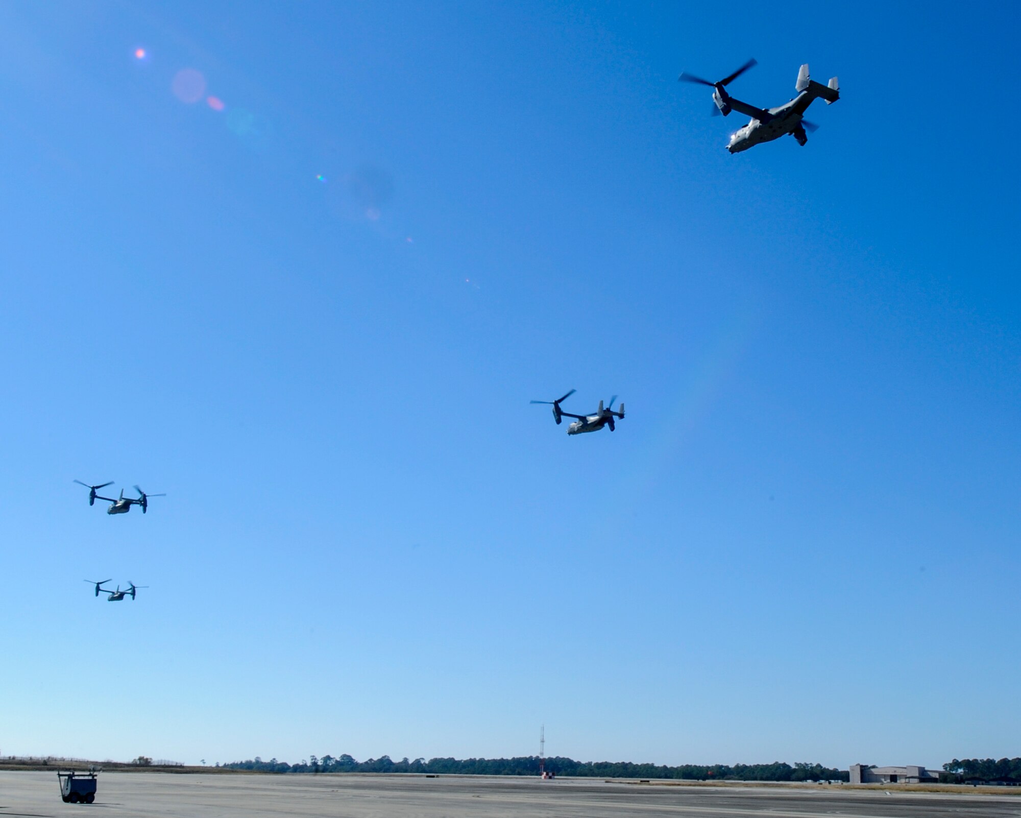 Four CV-22 Osprey aircraft take off in preparation for an air-to-air refueling with an MC-130H Combat Talon II from the flightline at Hurlburt Field, Fla., Nov. 17, 2016. The 8th and 15th SOS participated in a TAAR demonstration for Secretary of Defense Ash Carter during his visit to Hurlburt Field. (U.S. Air Force photo by Staff Sgt. Kentavist Brackin)